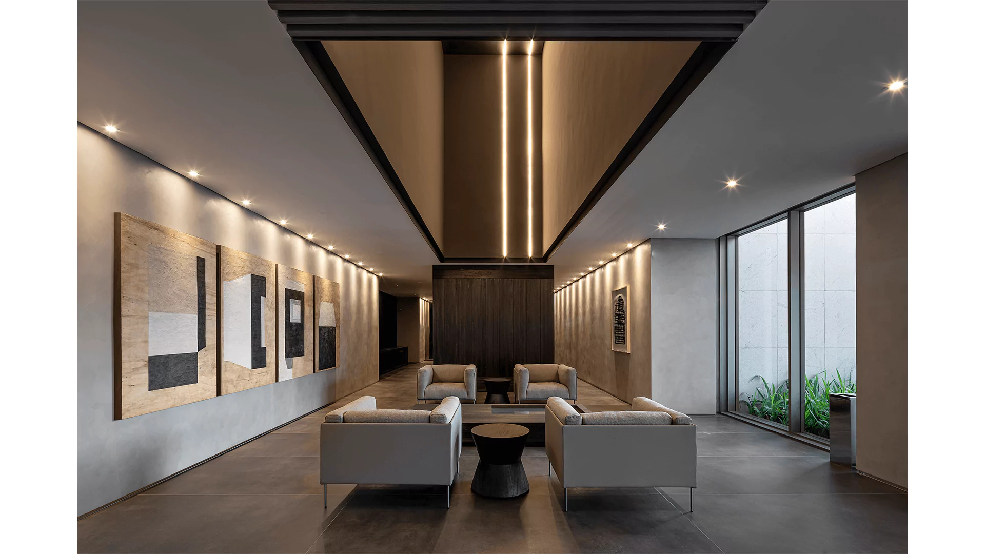 Hall de entrada com poltronas e áreas de acesso